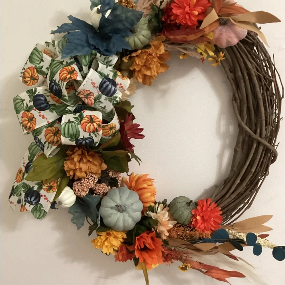 Orange and Green Holiday Wreath with Floral Accents